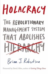 Книги для взрослых: Holacracy The Revolutionary Management System That Abolishes Hierarchy