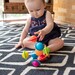 Іграшка-прорізувач Сенсорні кулі, Fat Brain Toys Wimzle дополнительное фото 5.